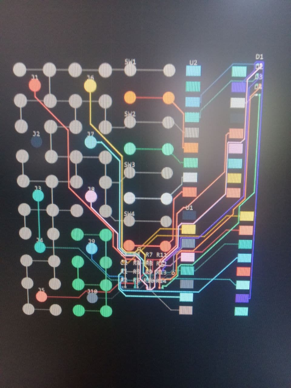 Dense multi-net PCB routing in KiCad, visualised by net colour